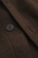 Close-up front view of the Lunaria Cashmere Cashmere Jacket dark brown showing pure cashmere fabric, very soft touch, slim fit, five-button style, notched collar, slanted front pockets, and unlined design.