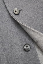 Close-up front view of Ami Paris Grey Jacket showing wool-cashmere fabric and branded button detail.

Description: <p>Stylish through the transitional season: This jacket by AMI PARIS convinces with a casual cut made of wool and cashmere – a versatile com