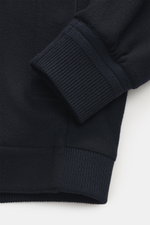 Close-up front-side view of the Zegna Cashmere blouson navy showing rib knit elastic cuff and hem, pure cashmere fabric with water repellent coating.