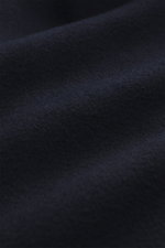 Close-up front view of the navy fabric texture of the Zegna Cashmere blouson navy, highlighting its soft, water repellent cashmere.