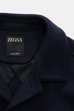 Close-up front view of the Zegna Jacket navy collar and label, made of wool and cashmere with a soft feel and slim fit.

Description: <p>The lightweight jacket by ZEGNA made of wool and cashmere features a boxy cut and soft feel, representing Italian top 