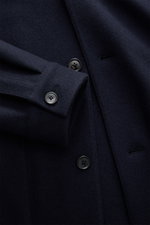 Close-up front view of the Zegna Jacket navy showing buttons, adjustable collar, and sleeve cuff detail in wool-cashmere fabric.

Description: <p>The lightweight jacket by ZEGNA made of wool and cashmere features a boxy cut and soft feel, representing Ita