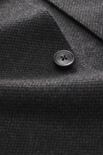 Zegna Cashmere jacket dark grey/black checkered close-up from front showing pure cashmere fabric, soft touch, slim fit, four-button placket, turn-down collar, patch front pockets, sleeve cuffs with buttons, rear side vents, half lined, two inside pockets.