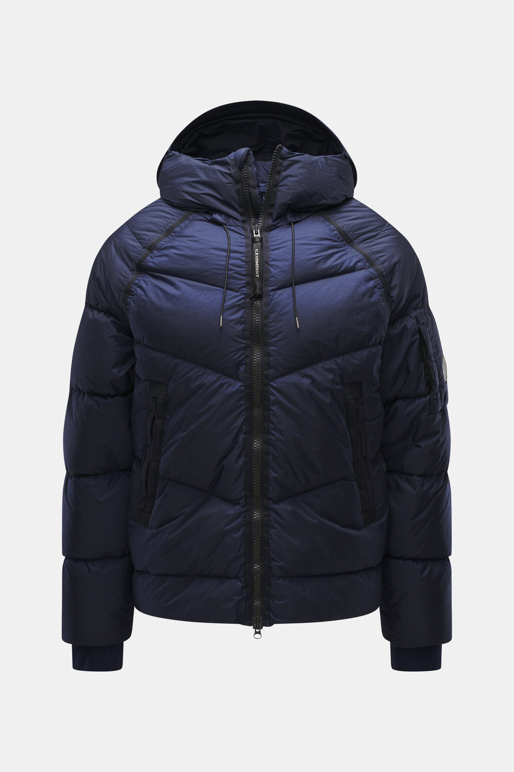 Front view of C.P. Company Down jacket dark blue featuring high-quality ripstop microfiber, lightly textured feel, wind- and water-repellent, warm down filling, garment dyed, slim fit, robust two-way zipper, practical hood, front zipper pockets, sleeve po