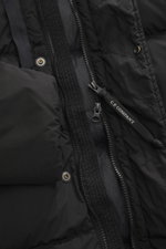 Close-up view of the C.P. Company Down jacket 'Nycra-R' black, showing the high-quality, recycled microfiber fabric, two-way zipper with C.P. Company branded pull, wind flap with press studs, and quilted design. This slim fit jacket features very lightwei
