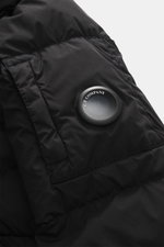 Close-up side view of C.P. Company Down jacket 'Nycra-R' black showcasing high-quality recycled microfiber, water-repellent fabric, warm down filling, elastic slim fit, garment dyed, hood with drawstring, two-way zipper, wind flap with press studs, zipper