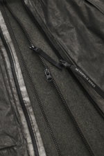 Close-up view of the C.P. Company Jacket 'Metropolis' dark grey, showing high-quality microfiber, smooth feel, durable zipper, and warm wool inlay.
