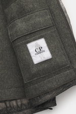 Close-up view of the inner pocket with C.P. Company label on the C.P. Company Jacket 'Metropolis' dark grey, made of high-quality microfiber with smooth feel, wind- and water-repellent, warm wool inlay, slim fit, durable zipper, high-closing collar, hood 