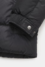 Close-up image of the Herno Down jacket black sleeve cuff, showing high-quality microfiber, soft touch, warm down filling, regular fit, durable zipper, practical hood with drawstring, slanted hip pockets with zipper, smooth lining fabric, adjustable hem w
