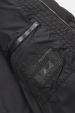 Close-up front-side view of the Herno Down jacket black, made with high-quality microfiber, soft touch, warm down filling, regular fit, durable zipper, practical hood with drawstring, slanted hip pockets with zipper, smooth lining fabric, adjustable hem w