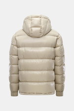 Herno Down jacket beige shown from the back, made of high-quality microfiber with smooth feel, warm down filling, regular fit, two-way zipper, detachable hood, slanted hip pockets with zipper, soft lining fabric, sleeve zipper pocket with patch, and one i