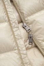 Close-up front view of Herno Down jacket beige zipper showcasing high-quality microfiber, smooth feel, warm down filling, regular fit, two-way zipper, detachable hood, slanted hip pockets with zipper, soft lining fabric, zipper pocket with patch on the sl