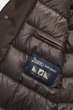 Close-up interior view of the Herno Down jacket gray brown, showing quilted lining, zippered inner pocket, and fabric details with mix of microfiber and viscose, soft touch, light down filling, regular fit, two-way zipper, wind flap with snap buttons, rem