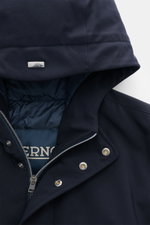 Close-up front view of the Herno Down short coat dark navy, showing high-quality microfiber with a slightly textured feel, light down filling, regular fit, two-way zipper, wind flap, hood with drawstring, slanted hip pockets with zipper, smooth lining fab
