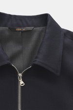 Close-up front view of the Briglia 1949 Jacket 'Bill' navy, made of pure virgin wool with a slightly textured feel, slim fit, turn-down collar, two-way zipper, cuffed sleeve ends, slanted welt pockets, smooth lining fabric, and one inside pocket.