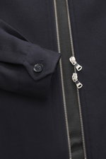 Close-up front view of Briglia 1949 Jacket 'Bill' navy, showing pure virgin wool with slightly textured feel, slim fit, turn-down collar, two-way zipper, cuffed sleeve ends, slanted welt pockets, smooth lining fabric, and one inside pocket.
