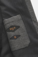 Close-up view of the Briglia 1949 Jacket 'Bill' dark grey melange sleeve showing pure new wool fabric with a slightly textured feel, cuffed sleeve ends, and brand labels; slim fit jacket features a turn-down collar, two-way zipper, slant welt pockets, smo