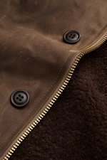 Close-up front view of the Manifattura Ceccarelli Waxed jacket 'Deck Jacket' brown, showing paraffin waxed cotton fabric, dark buttons, brass zipper, and soft alpaca wool lining, built for the elements with water repellent, breathable, regular fit, storm 