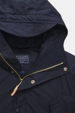 Close-up front view of the Manifattura Ceccarelli Down jacket 'Fisherman' navy, pure cotton, soft touch, regular fit, warm down filling, two-way zipper, wind flap with press studs, high-closing collar with hood, raglan sleeves, slanted front pockets with 