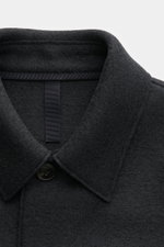 Close-up front view of Harris Wharf London Wool jacket navy collar and button in thick felted virgin wool fabric, unlined, casual and cosy.