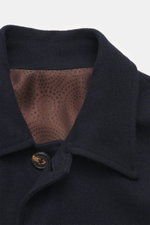 Close-up front view of the Doppiaa Jacket 'Aaliante' navy showing turn-down collar, button, and patterned brown half lining; mix of wool, microfiber, cashmere, soft feel, regular fit, concealed five-button placket, patch pockets with flap, sleeve cuffs wi