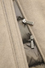 Close-up front view of the beige fabric and silver zipper of the Moorer Daunenjacke 'Albini' navy, showing the water-repellent texture and detailed stitching. The luxurious, short-cut, water-resistant jacket features a mix of viscose and microfiber with a