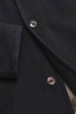 Close-up front view of Moorer Daunenparka 'Vannes' dark navy showing high-quality microfiber fabric, smooth texture, water-repellent, warm down filling, removable double-front, collar with detachable lambswool trim, slim fit, wind flap with hidden four-bu