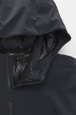 Close-up front view of UBR Down jacket 'Phantom' dark navy showing the high-closing stand-up collar, practical hood, two-way zipper, elastic microfiber, water-repellent fabric, light down filling, slim fit, reflective UBR logo on chest, zippered front poc