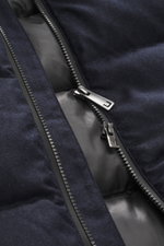 Close-up front view of the UBR Merino Down Jacket 'Savile' navy melange zipper, showing pure merino wool fabric with warming down filling and smooth lining.