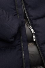 Close-up front view of UBR Down jacket 'Concord' navy melange showing the two-way zipper, pure wool fabric, and soft touch texture.

<p>Urban style meets high performance: The 'Concord' down jacket from UBR combines innovative functionality with modern de