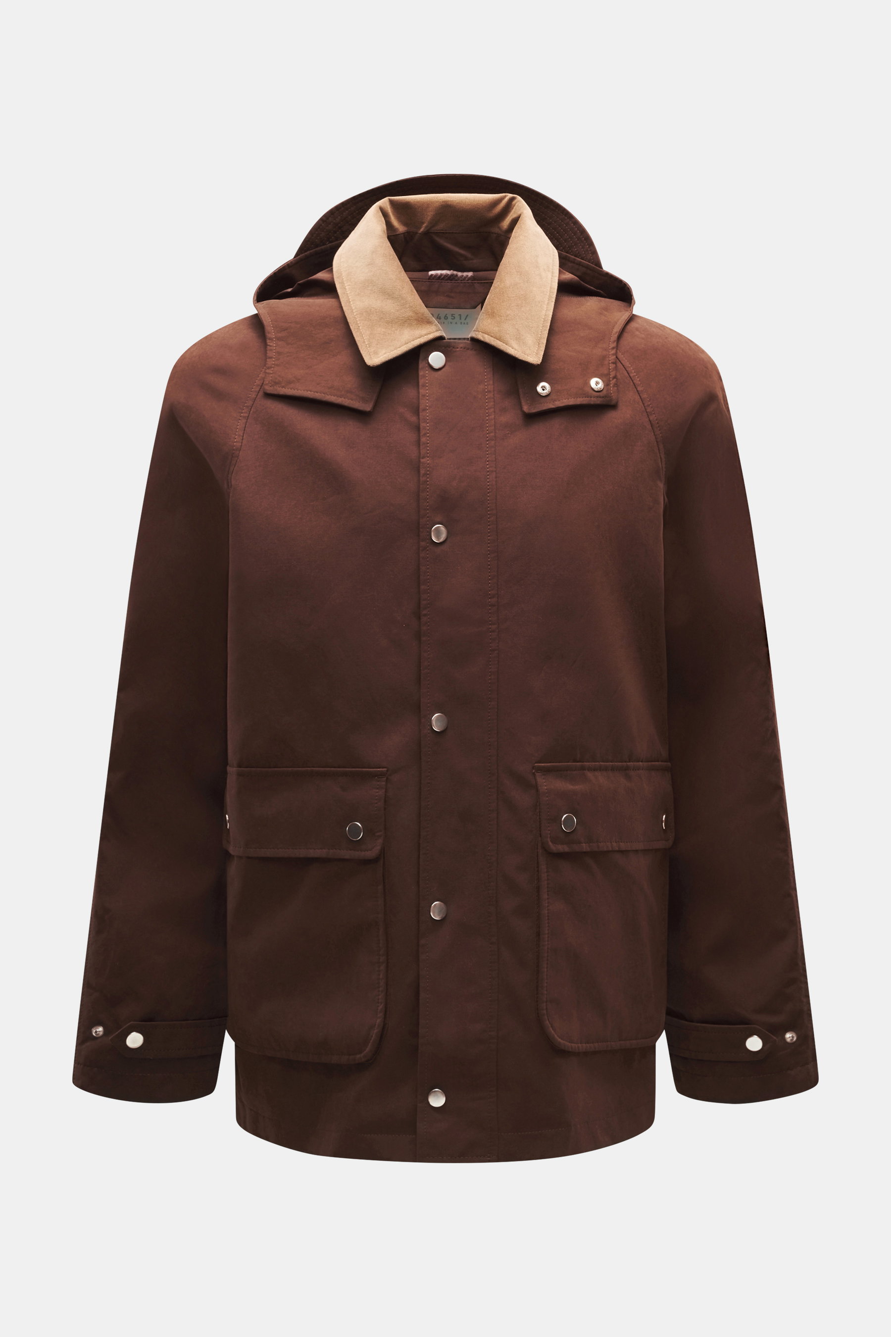 Front view of the 04651/ A trip in a bag Wax Jacket 'Sailor' brown, a slim fit waxed cotton and microfiber jacket with corduroy collar, detachable hood, patch pockets, and snap button wind flap.

Description: 
<p>Timeless classic for the transitional seas