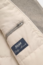 Close-up inner view of Eddy Monetti Cashmere blouson 'Rius' grey melange showing zippered pocket, label, and wool lining from top angle.

Additional description: 
<p>High-quality blouson by EDDY MONETTI: The model 'Rius' impresses with a comfortable fit m