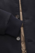 Close-up front view of the Eddy Monetti Cashmere down blouson 'Teos' beige showing rib-knit cuff, button, and quilted lining.

Description: <p>Lightweight, pleasantly warming quality: The sporty blouson 'Teos' features a high-quality down filling and a so