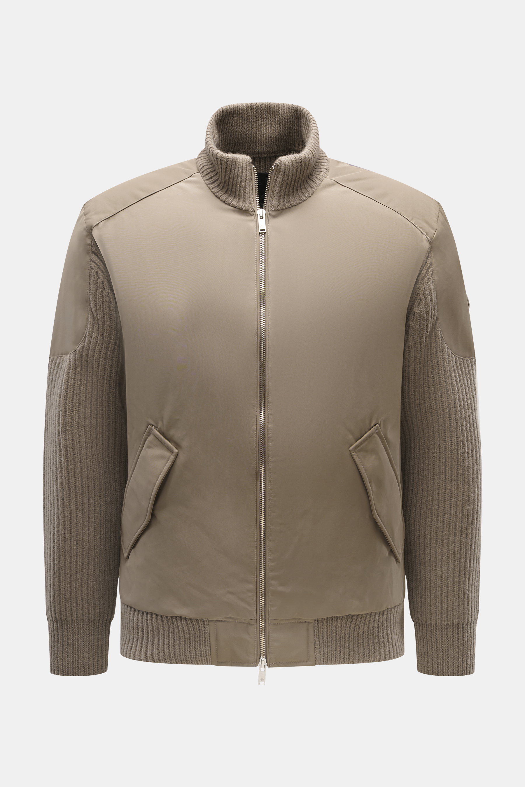 Front view of Moose Knuckles Down blouson 'Magnus Knit Hybrid' taupe, featuring high-quality microfiber, wool knitted sleeves, soft touch, slim fit, durable two-way zipper, high ribbed collar, metal logo on upper arm, hip pockets with flap, light down fil