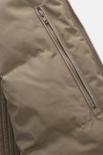 Close-up front view of Moose Knuckles Down blouson 'Magnus Knit Hybrid' taupe showcasing high-quality microfiber, durable two-way zipper, hip pocket with flap, and knitted wool sleeves with soft touch.