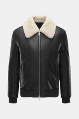 Front view of Moose Knuckles Leather blouson 'Toba Bomber' black with lambskin collar, slim fit, two-way zipper, and metal logo on upper arm.

Description: <p>Perfect for urban winter looks: The 'Toba Bomber' blouson from MOOSE KNUCKLES made of fine leath