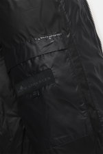 Close-up interior view of the Moose Knuckles Down blouson 'King's Puffer' black showing high-quality microfiber, slim fit, warm down filling, two inner pockets, typical blouson collar made of ribbed knit, front pockets with snap button, rubberized label o