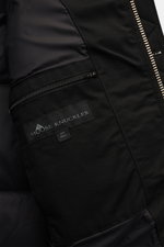 Close-up inside view of Moose Knuckles Down jacket 'Original 3Q' black showing smooth lining, inner zip pocket, and label, highlighting quality.