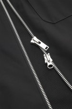 Close-up front view of Moose Knuckles Jacket 'Jacques' black showing high-quality microfiber, smooth feel, slim fit, robust two-way zipper, turn-down collar, patch chest pockets with flap, slanted welt pockets, metal logo on upper arm, cuff sleeves with c