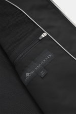 Close-up interior view of Moose Knuckles Jacket 'Jacques' black showing mesh lining, two zipper inner pockets, high-quality microfiber with smooth feel, slim fit, robust two-way zipper, turn-down collar, patch chest pockets with flap, slanted welt pockets