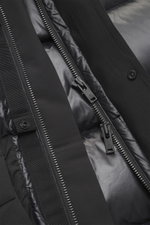 Close-up view of the Moose Knuckles Down jacket 'Briar 3Q' black zipper and inner lining, showing high-quality microfiber, smooth touch, wind- and water-repellent fabric, Slim Fit, warm down filling, two-way zipper, hood with drawstring, patch front pocke