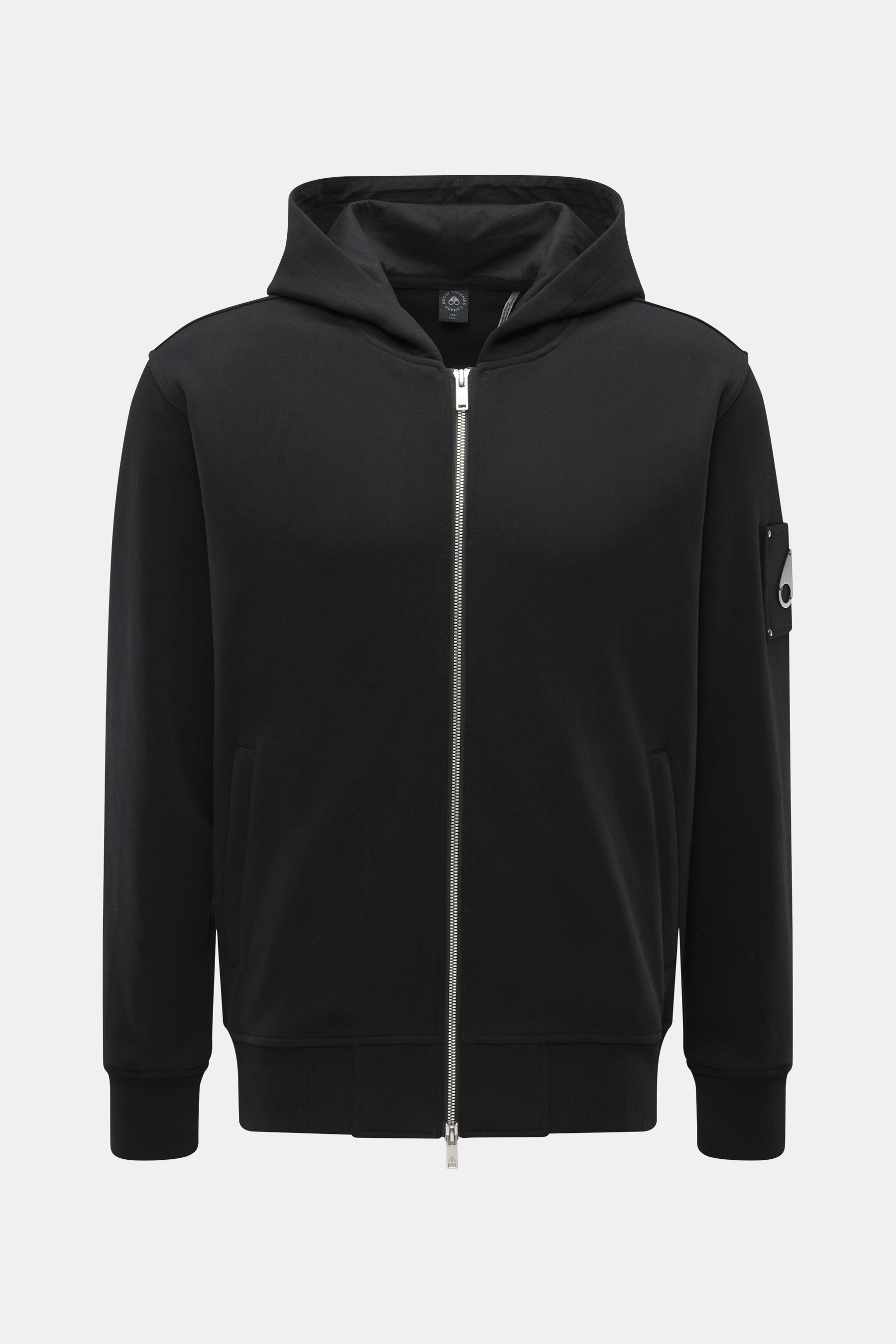 Front view of Moose Knuckles Sweat jacket 'Hartsfield Zip-Up' black, sweat made of pure cotton, soft feel, slim fit, robust two-way zip, lined hood, integrated hip pockets, patch with signature metal emblem on the sleeve, wide ribbed bands.
