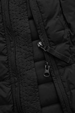 Close-up front view of the Stone Island Daunenweste 'Seamless Tunnel Nylon Down-TC' schwarz, showing the lightweight down-filled black vest with high-quality microfiber, smooth feel, slim fit, two-way zipper, wind flap with snap button, stand collar, zipp