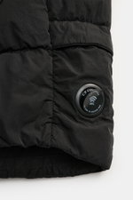 Close-up side view of C.P. Company Daunenweste 'D.D. Shell' dark navy with smooth ripstop microfiber, light down filling, and round lens detail.