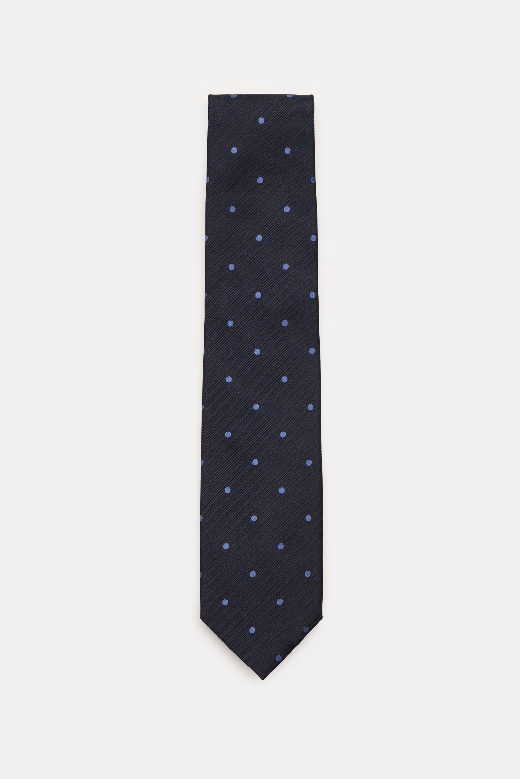 Tom Ford Seidenkrawatte navy/graublau gepunktet aus reiner Seide, dezenter Glanz, monochromes Futter, Logo, Draufsicht.