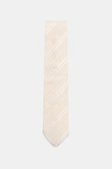 Front view of Tom Ford Silk tie cream/white striped with fine weave pattern, subtle sheen, pure silk, and branded lining, made in Italy, 8 cm wide. 

Italian craftmanship: This classic tie by TOM FORD in pure silk combines timeless elegance with a fine, g