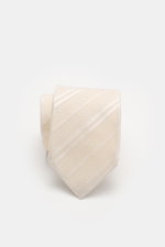 Close-up top view of Tom Ford Silk tie cream/white striped with subtle sheen, fine weave pattern, and branded lining, made in Italy.

Description: <p>Italian craftmanship: This classic tie by TOM FORD in pure silk combines timeless elegance with a fine, g