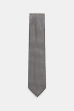 Top-down view of the Tom Ford Silk tie dark navy/white patterned, showcasing Italian craftsmanship in pure silk with a fine weave.