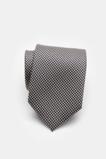 Close-up front view of Tom Ford Silk tie dark navy/white patterned with fine weave, subtle sheen, and pure silk texture.

Italian craftsmanship: This classic tie by TOM FORD in pure silk combines timeless elegance with a fine, graphic weave pattern and ad
