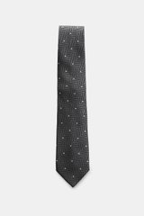 Front view of Tom Ford Silk tie dark grey/black/cream patterned, featuring a timeless herringbone pattern with polka dots, subtle sheen, and logo stitching.

Description: <p>Confident elegance down to the finest detail: This fine silk tie by TOM FORD is a